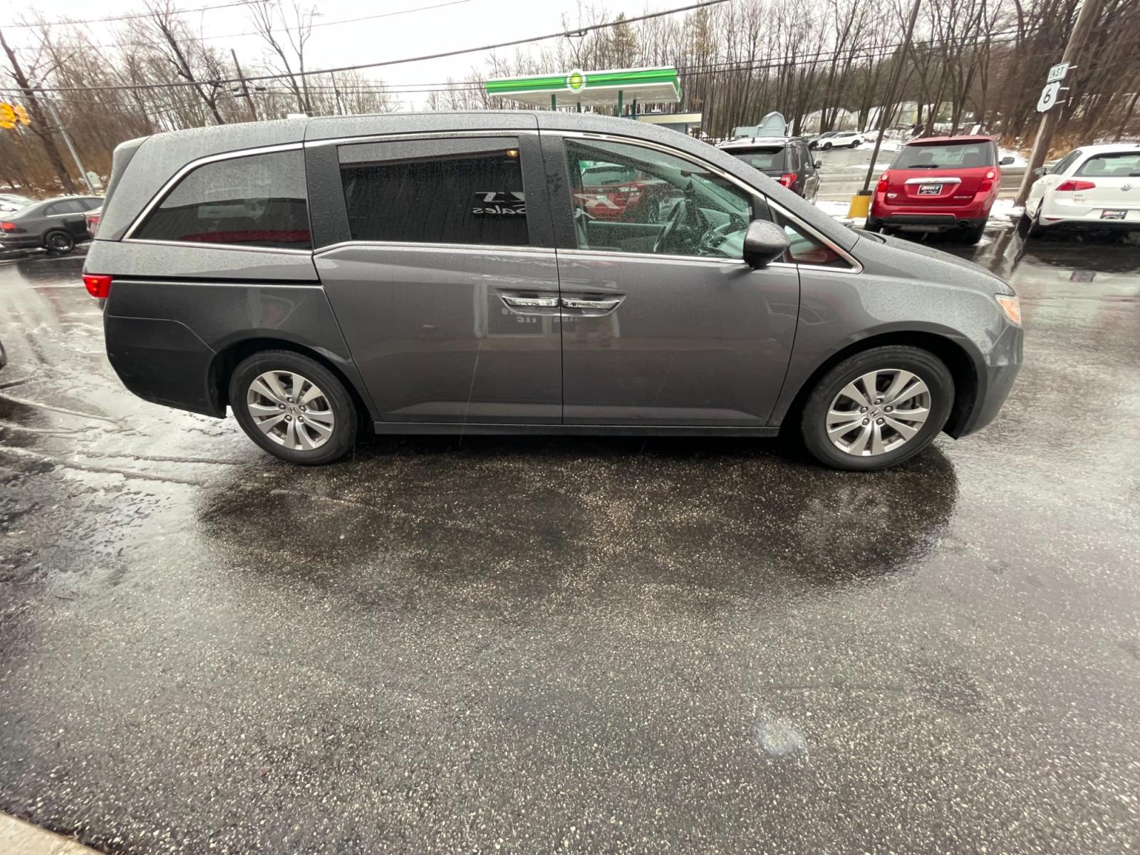 2016 Gray /Gray Honda Odyssey EX-L (5FNRL5H61GB) with an 3.5L V6 SOHC 24V engine, 6A transmission, located at 11115 Chardon Rd. , Chardon, OH, 44024, (440) 214-9705, 41.580246, -81.241943 - This 2016 Honda Odyssey EX-L is a versatile and comfortable minivan equipped with a 3.5-liter V6 engine paired with a 6-speed automatic transmission, providing a smooth driving experience. It's designed with convenience and luxury in mind, evident in features such as heated leather seats, power-adju - Photo #5